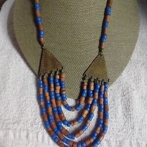 Blue and brass colored statement runway beaded necklace